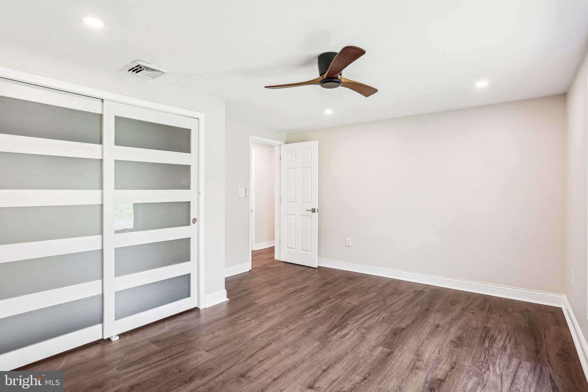 302 Fenwick Road Pilesgrove, NJ 08098 - Photo 28 of 51 a view of empty room with wooden floor and window