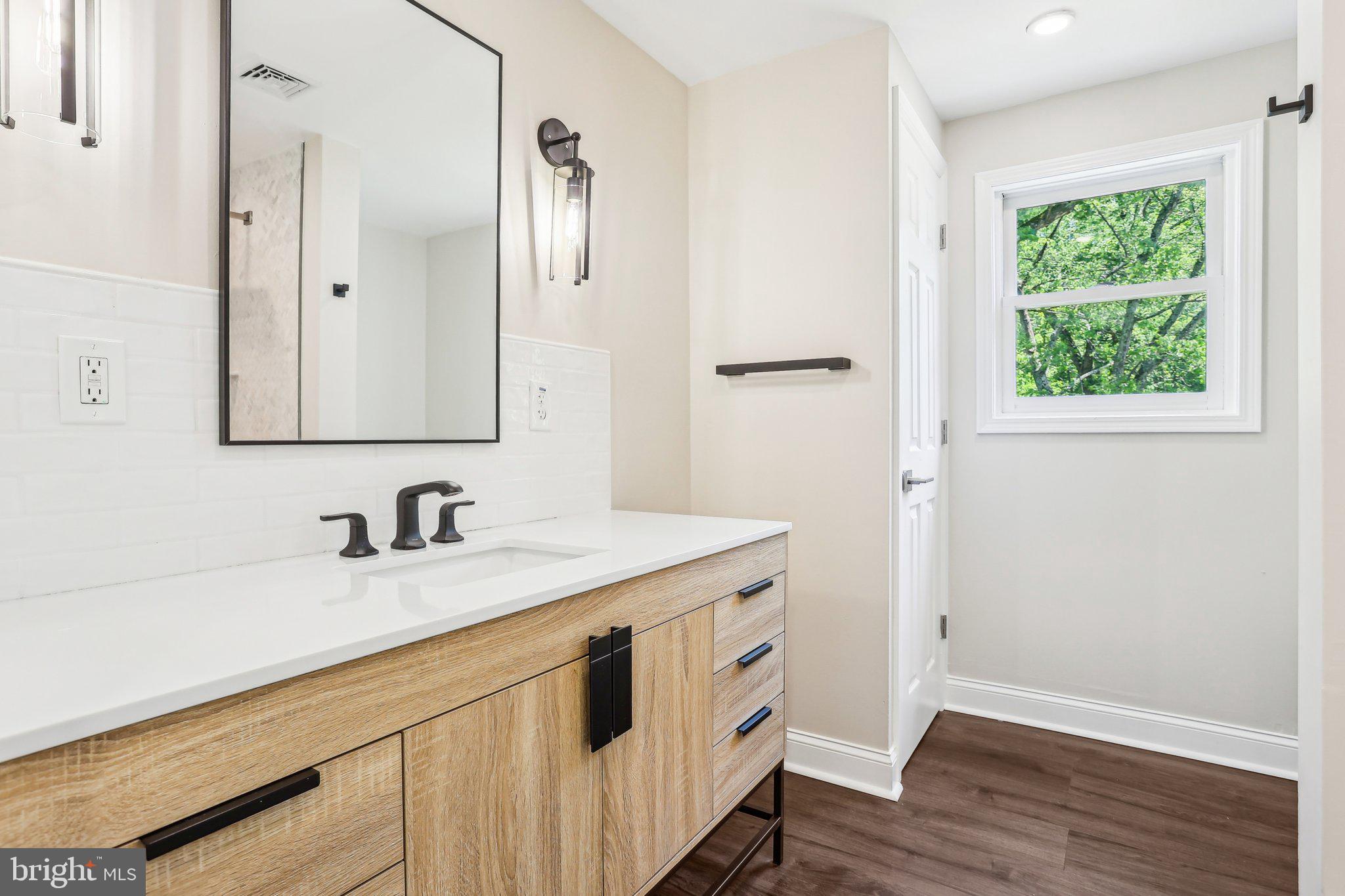 302 Fenwick Road Pilesgrove, NJ 08098 - Photo 29 of 51 a bathroom with a sink and a mirror