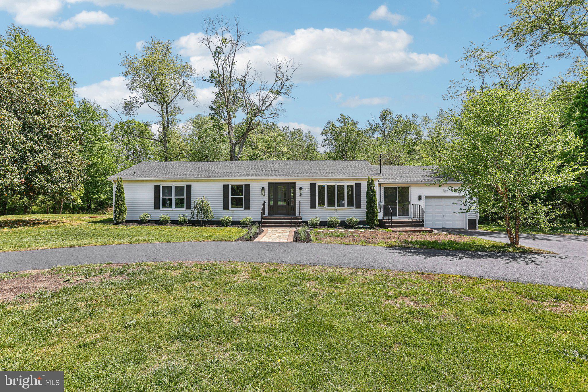 302 Fenwick Road Pilesgrove, NJ 08098 - Photo 3 of 51 a front view of house with yard and trees around