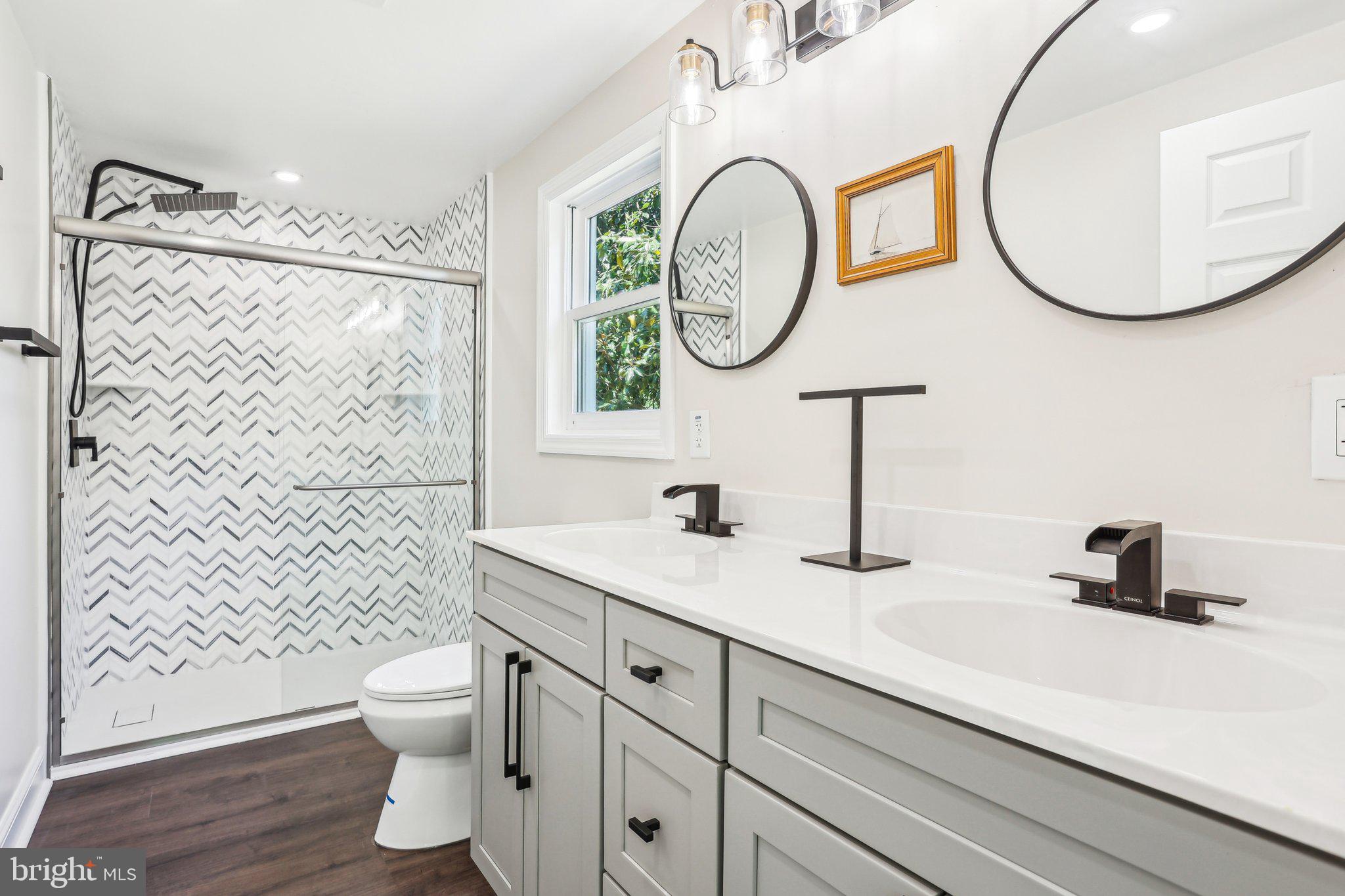 302 Fenwick Road Pilesgrove, NJ 08098 - Photo 31 of 51 a bathroom with a sink mirror vanity and toilet