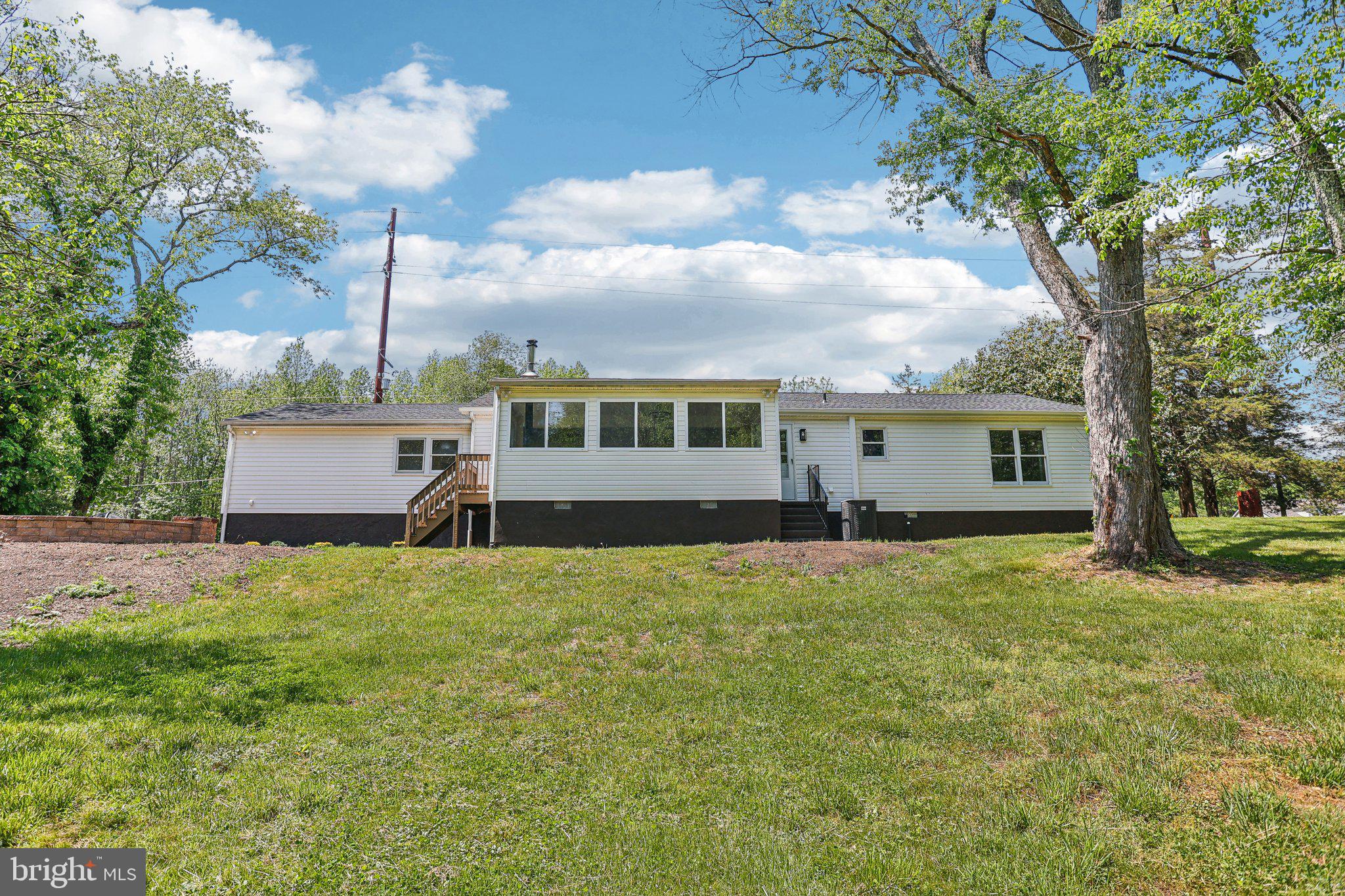 302 Fenwick Road Pilesgrove, NJ 08098 - Photo 36 of 51 a view of a house with a yard