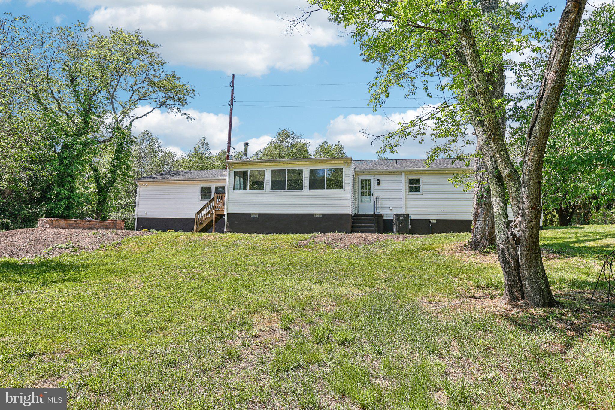 302 Fenwick Road Pilesgrove, NJ 08098 - Photo 37 of 51 a front view of house with yard and trees