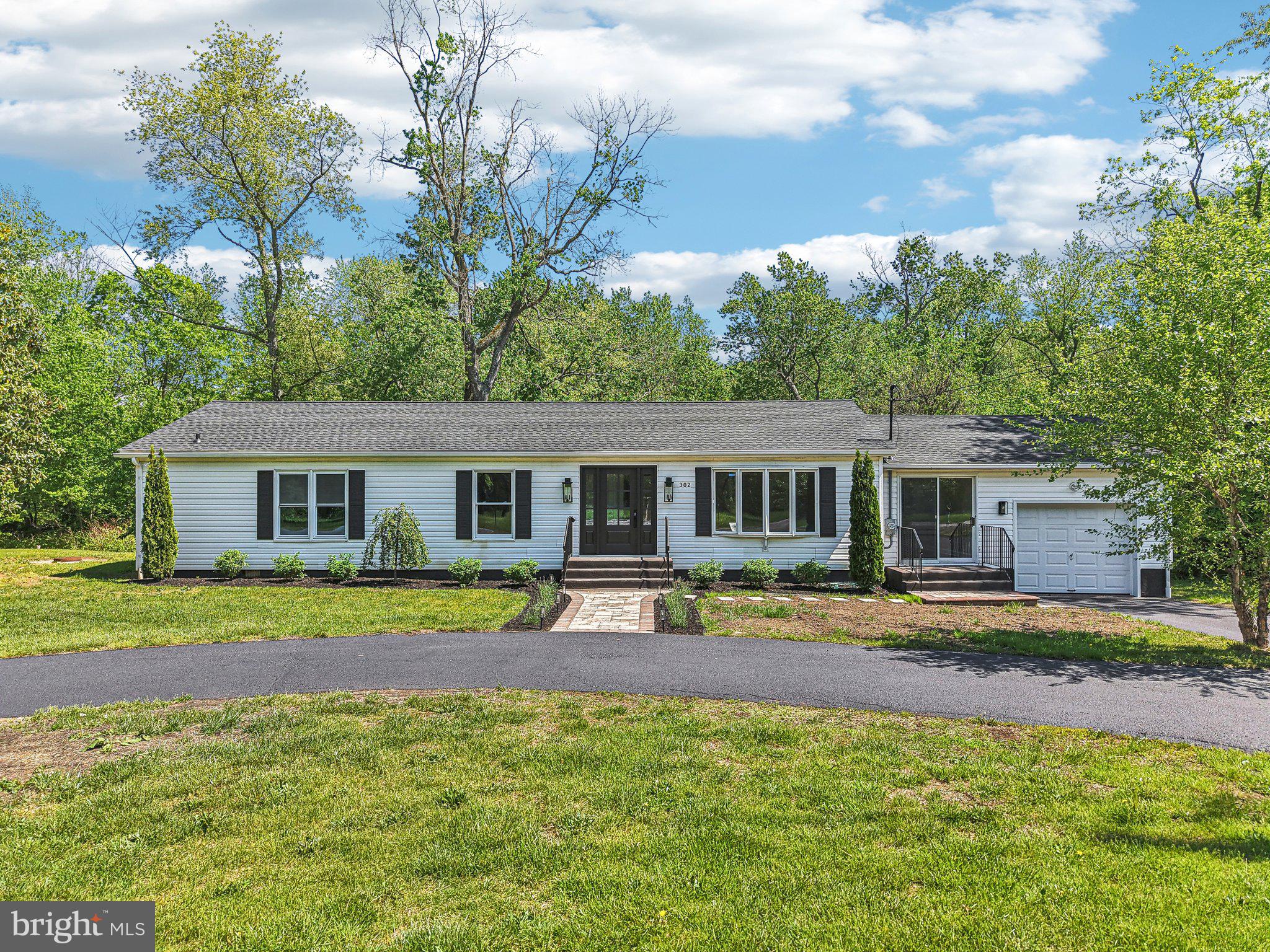 302 Fenwick Road Pilesgrove, NJ 08098 - Photo 41 of 51 a front view of a house with garden