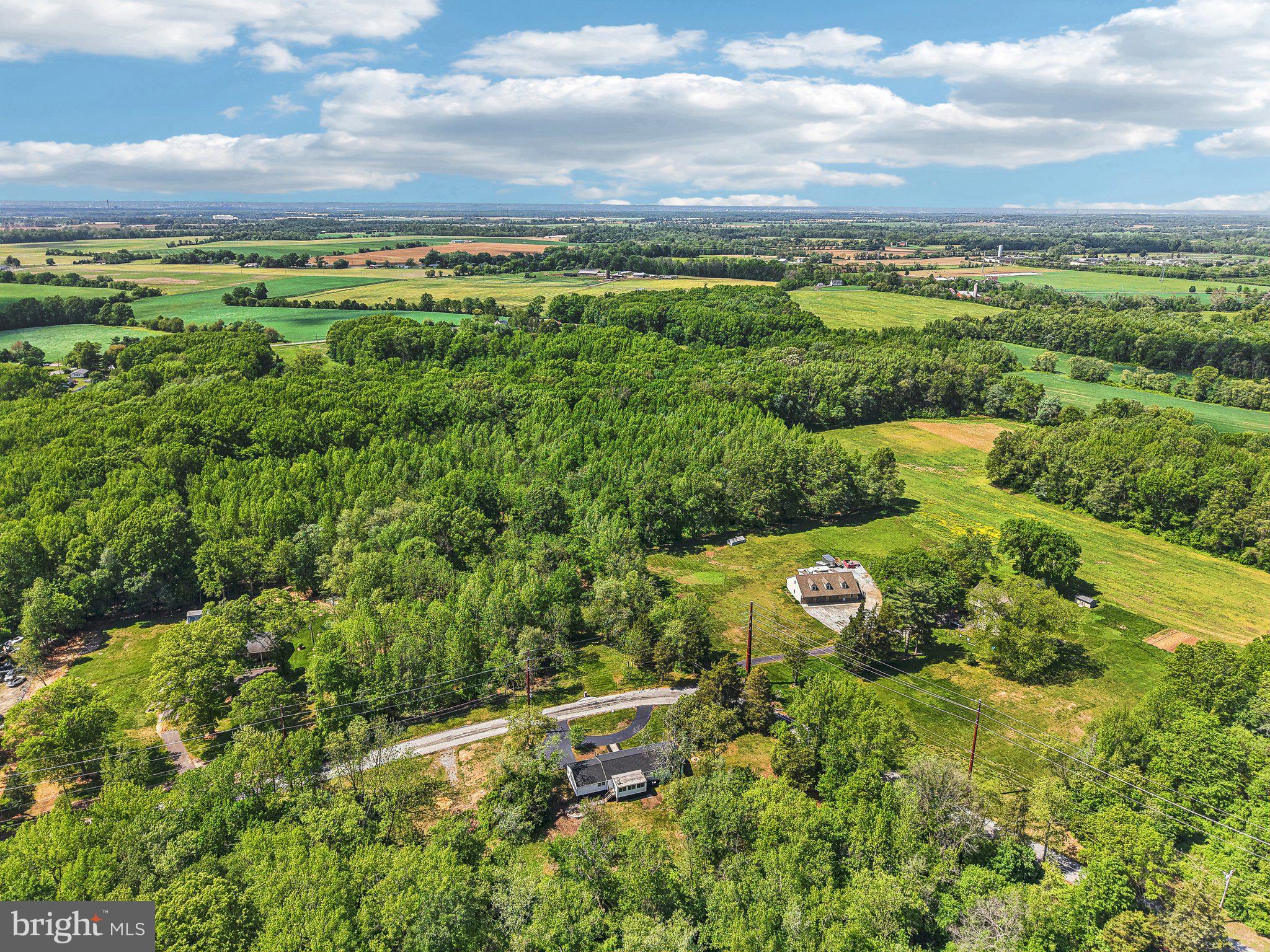 302 Fenwick Road Pilesgrove, NJ 08098 - Photo 49 of 51 a view of a city with lush green forest