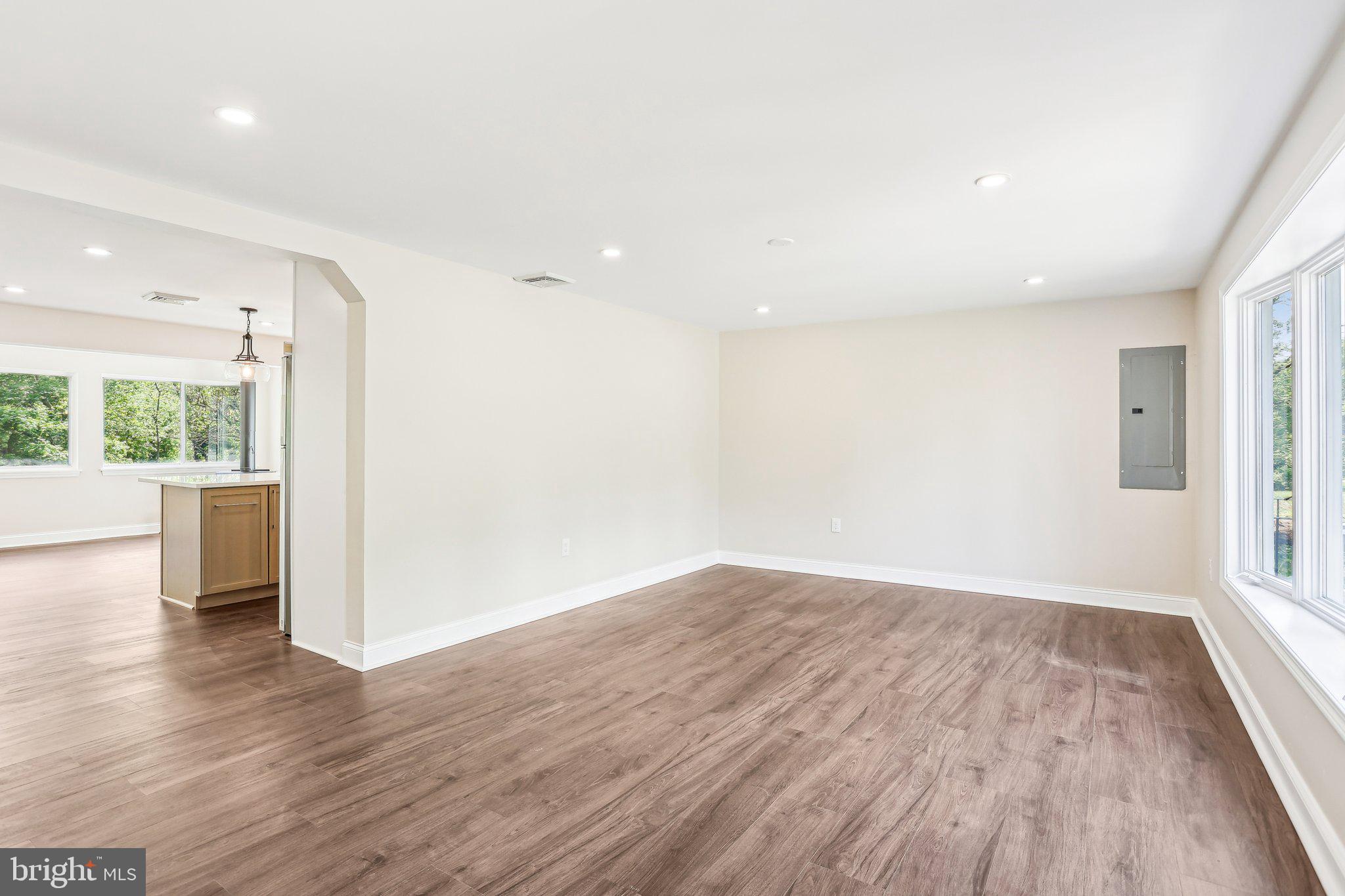 302 Fenwick Road Pilesgrove, NJ 08098 - Photo 9 of 51 wooden floor in an empty room with a window