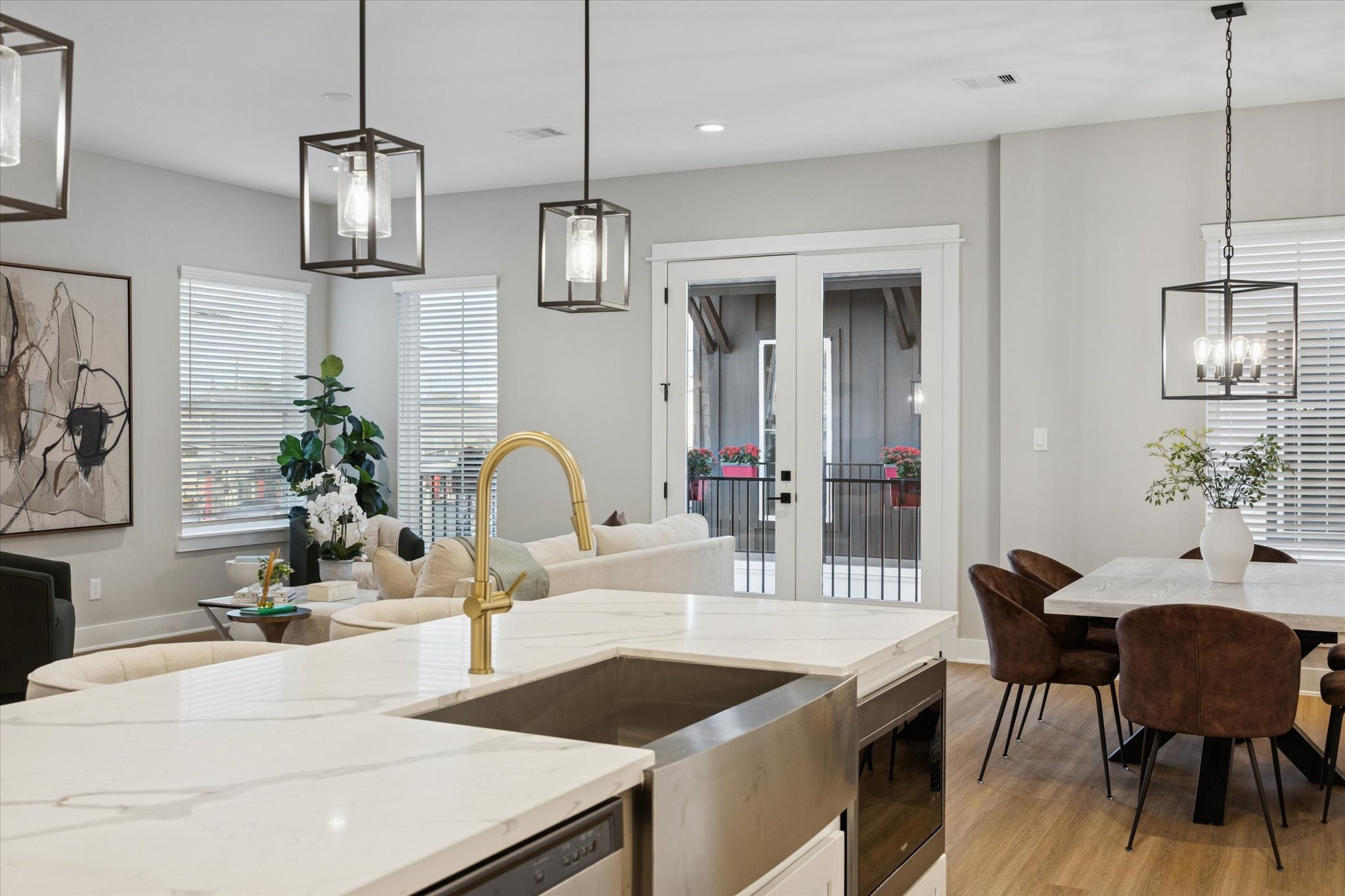 719 Thornton Road, Unit D Houston, TX 77018 - Photo 12 of 45 a kitchen with a dining table chairs and white cabinets