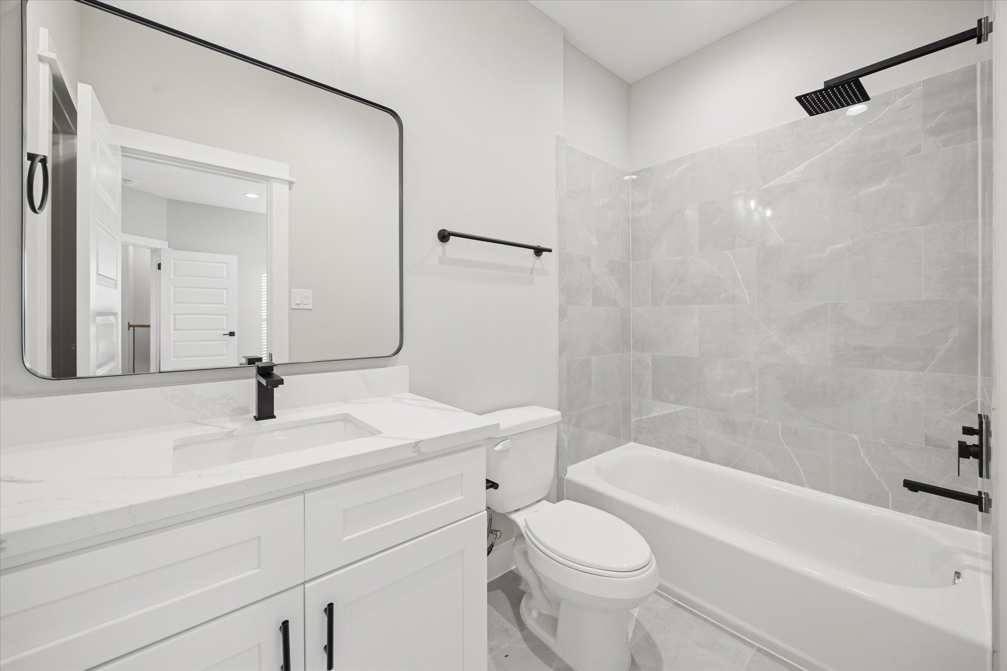 719 Thornton Road, Unit D Houston, TX 77018 - Photo 37 of 45 a bathroom with a sink a toilet and a mirror