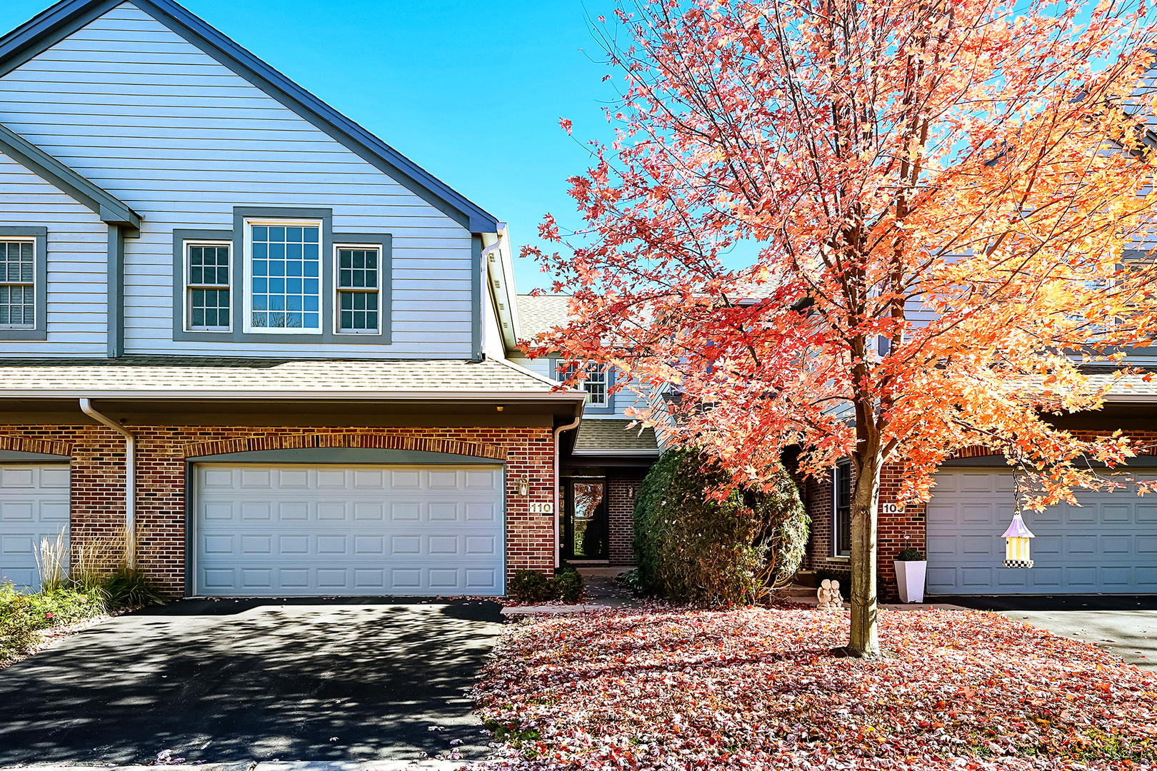 110 Waterside Place Burr Ridge, IL 60527 - Photo 1 of 44 a front view of a house with a yard