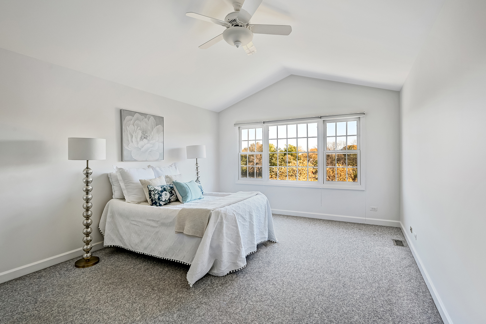 110 Waterside Place Burr Ridge, IL 60527 - Photo 16 of 44 a spacious bedroom with a bed and a window