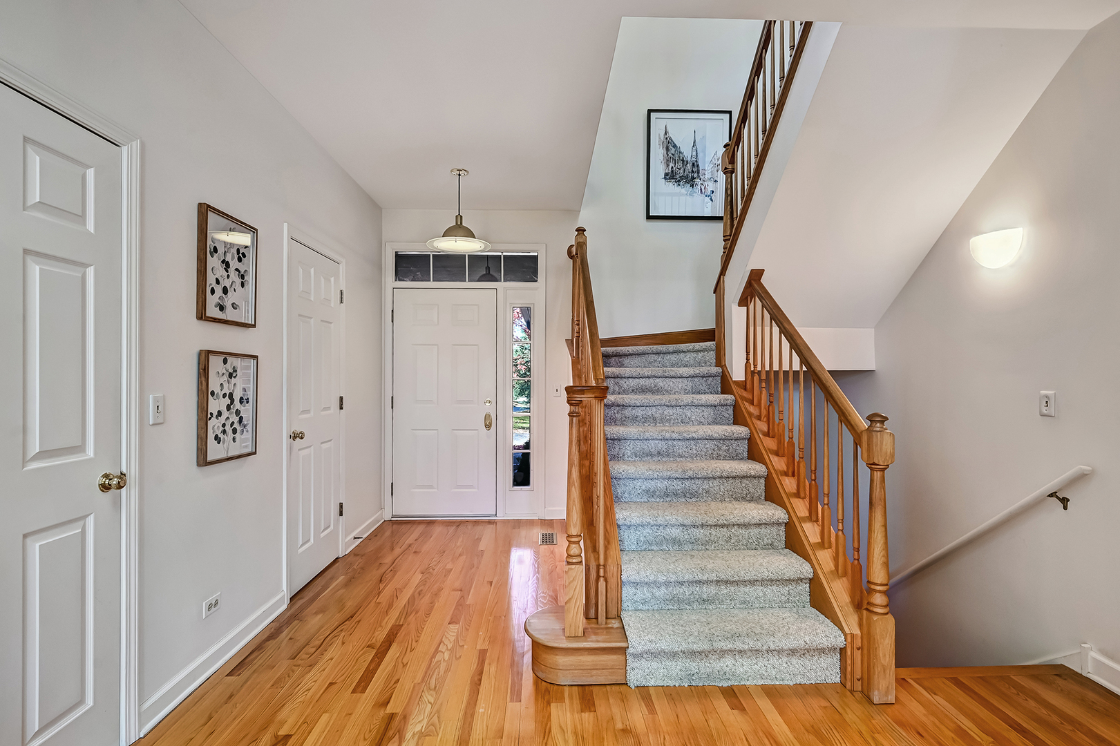 110 Waterside Place Burr Ridge, IL 60527 - Photo 5 of 44 a view of a hallway with wooden floor and entryway