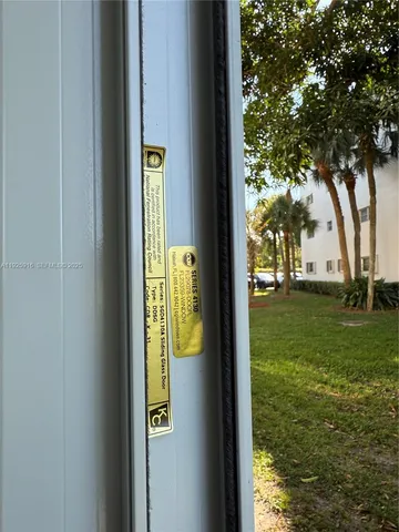 a kitchen with stainless steel appliances granite countertop a refrigerator a sink and a stove with wooden floor