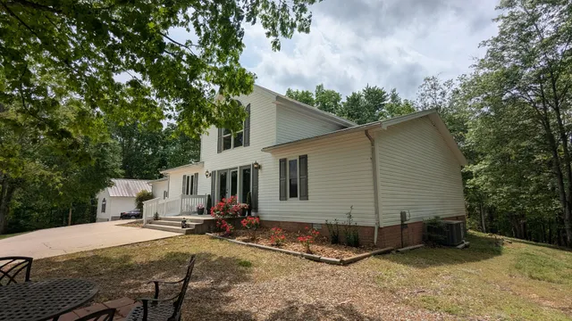 an aerial view of green landscape with trees