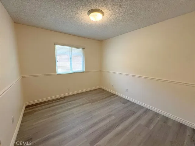 an empty room with a empty space and windows