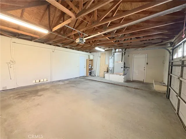 a view of a room with wooden walls