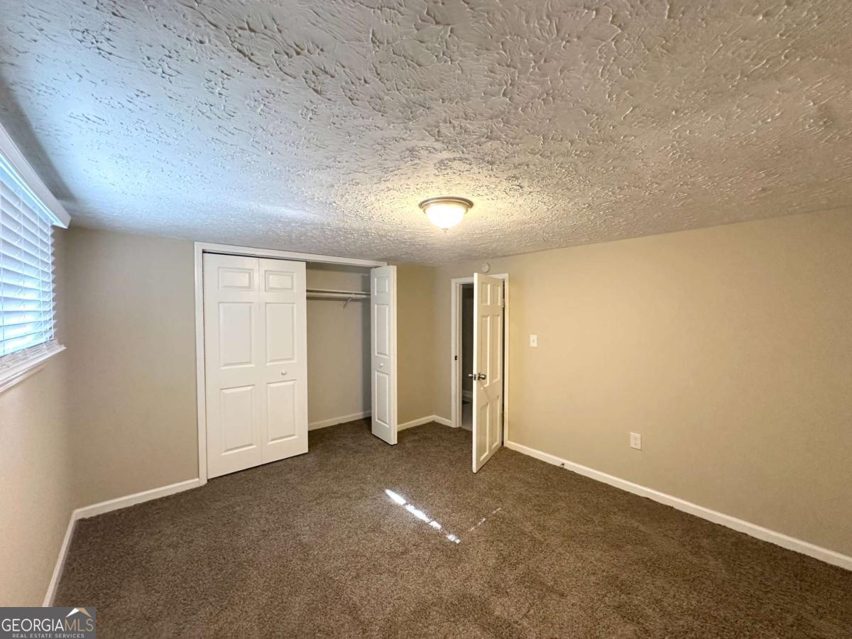 3456 Spring Circle Decatur, GA 30032 - Photo 11 of 22 an empty room with closet