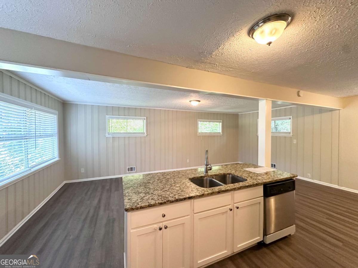 3456 Spring Circle Decatur, GA 30032 - Photo 6 of 22 a bathroom with a granite countertop sink and a mirror