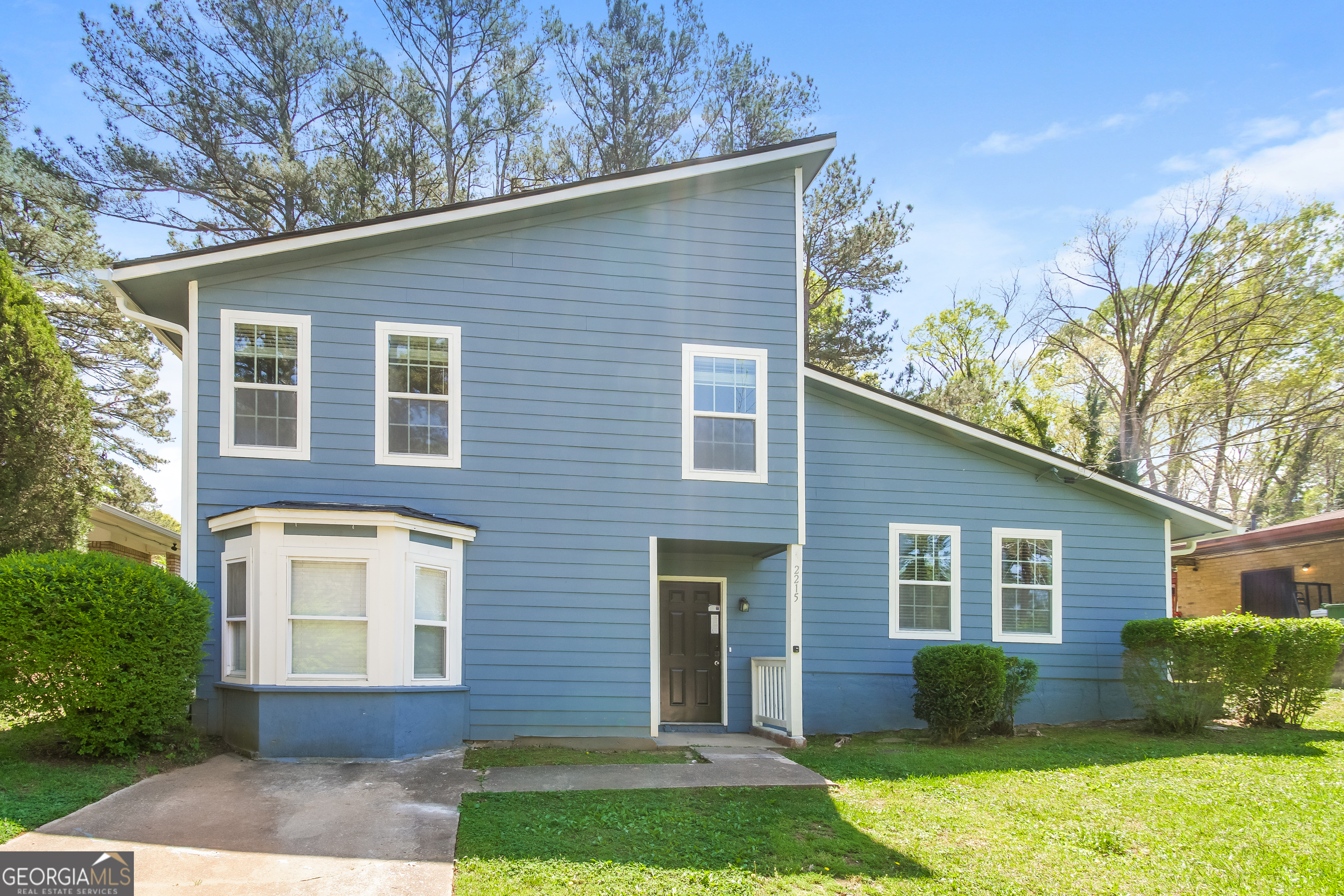 2215 Fairway Circle Southwest Atlanta, GA 30331 - Photo 1 of 18 a front view of a house with garden