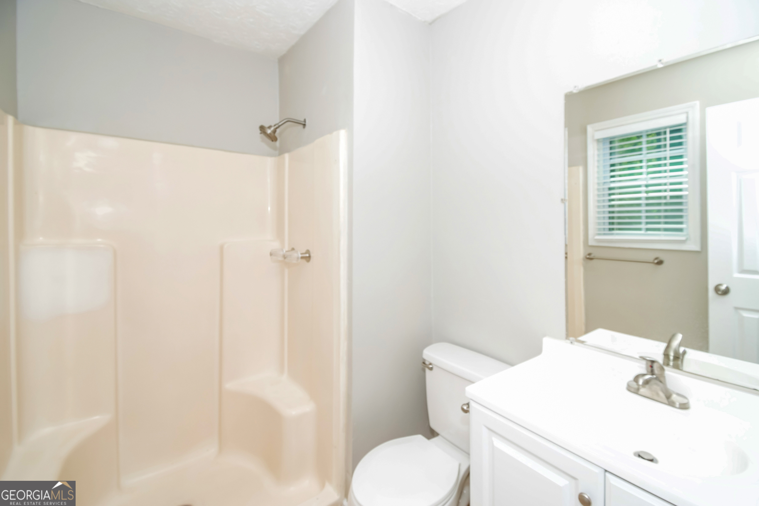 2215 Fairway Circle Southwest Atlanta, GA 30331 - Photo 12 of 18 a bathroom with a sink toilet and shower