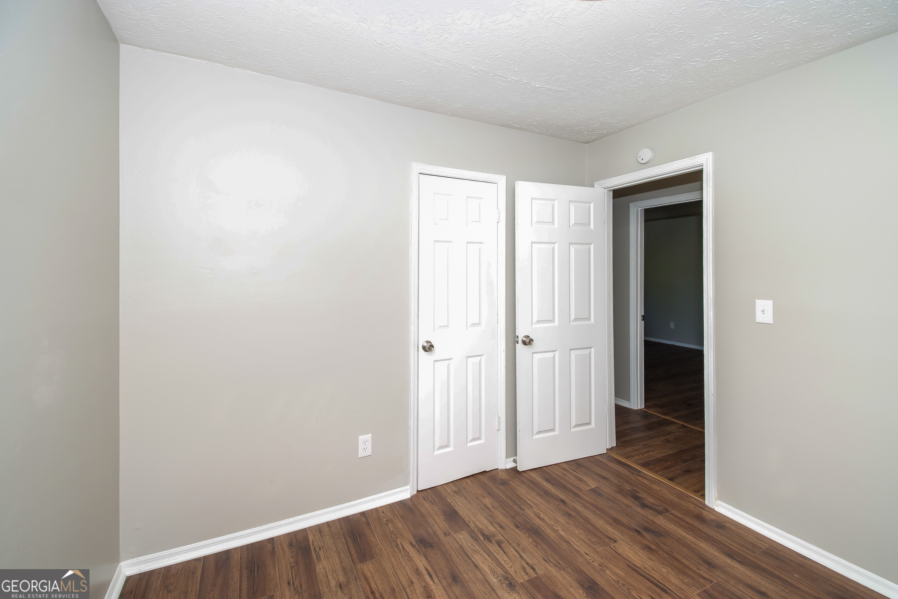 2215 Fairway Circle Southwest Atlanta, GA 30331 - Photo 13 of 18 a view of an empty room with wooden floor