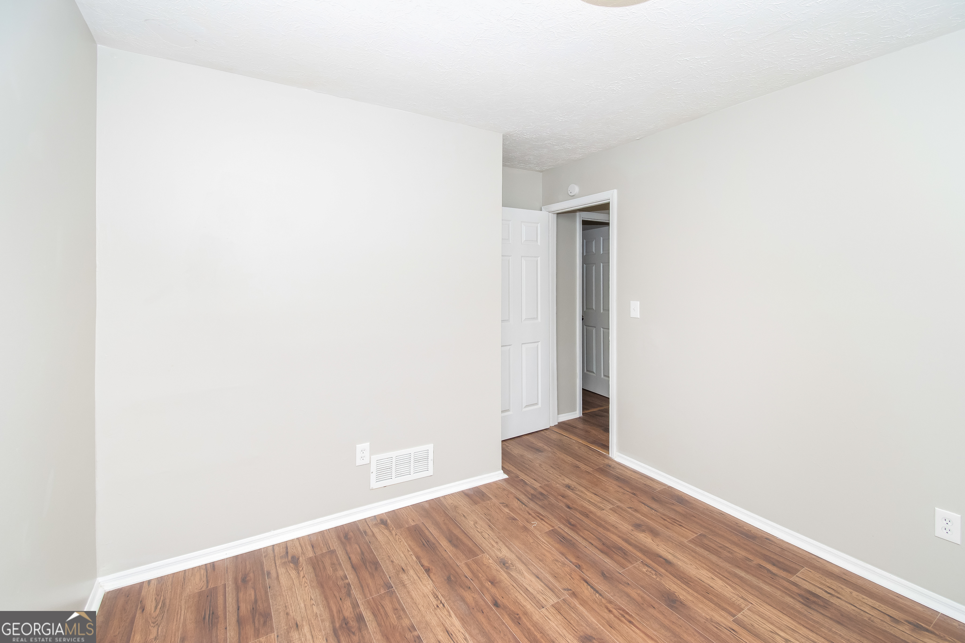 2215 Fairway Circle Southwest Atlanta, GA 30331 - Photo 15 of 18 a view of an empty room with wooden floor