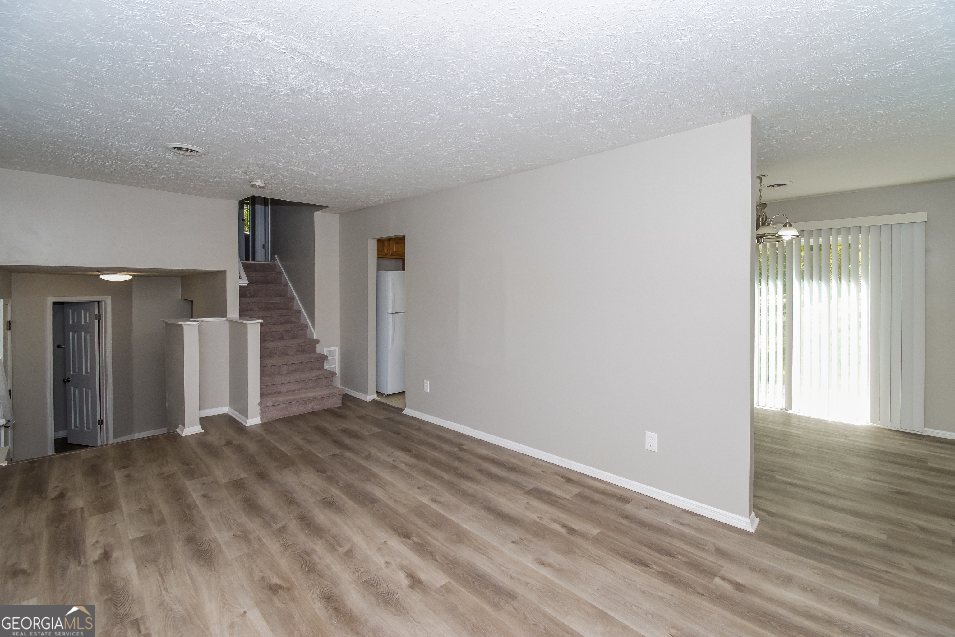 2215 Fairway Circle Southwest Atlanta, GA 30331 - Photo 5 of 18 a view of an empty room with wooden floor