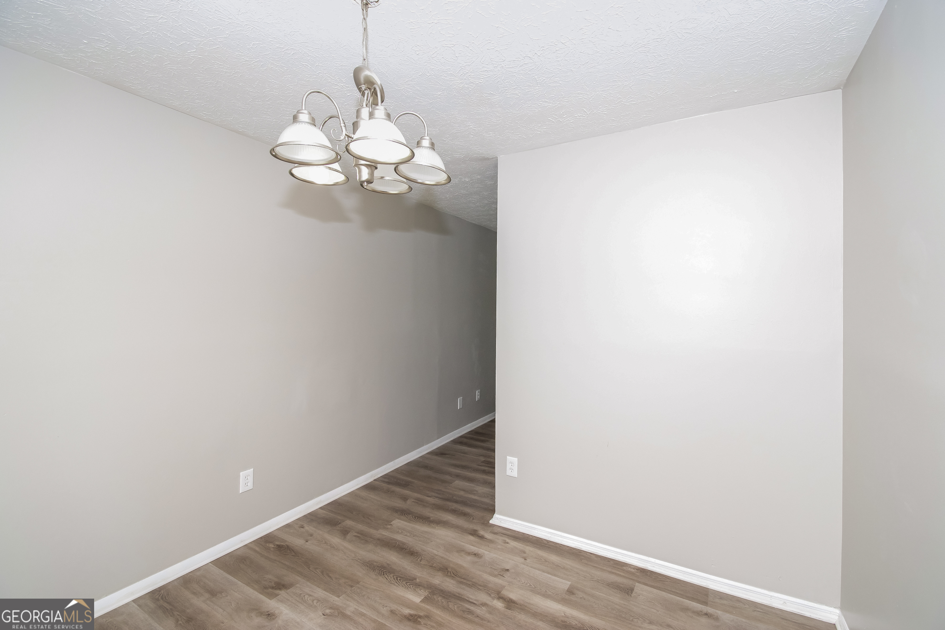 2215 Fairway Circle Southwest Atlanta, GA 30331 - Photo 7 of 18 a view of a chandelier fan and wooden floor