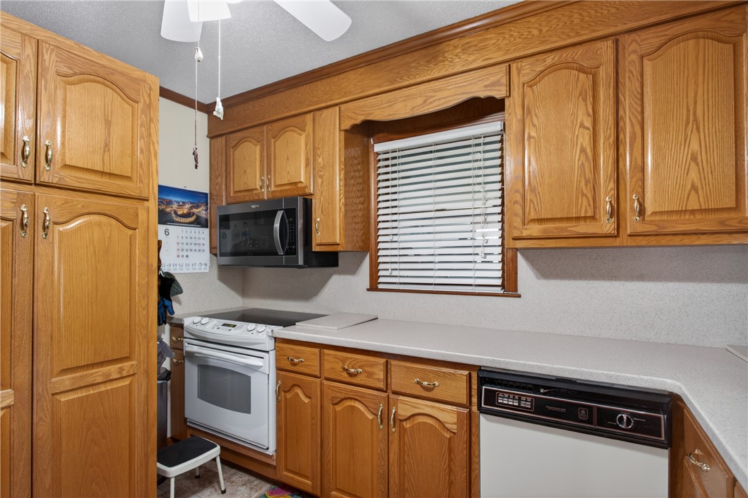 145 State Rd S-4-935 Pendleton, SC 29670 - Photo 8 of 47 A functional kitchen boasts ample cabinetry and essential appliances for everyday living.