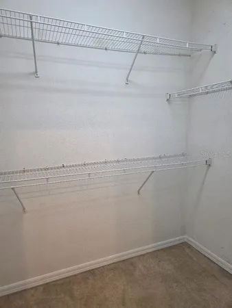 a view of a room with racks on the wall
