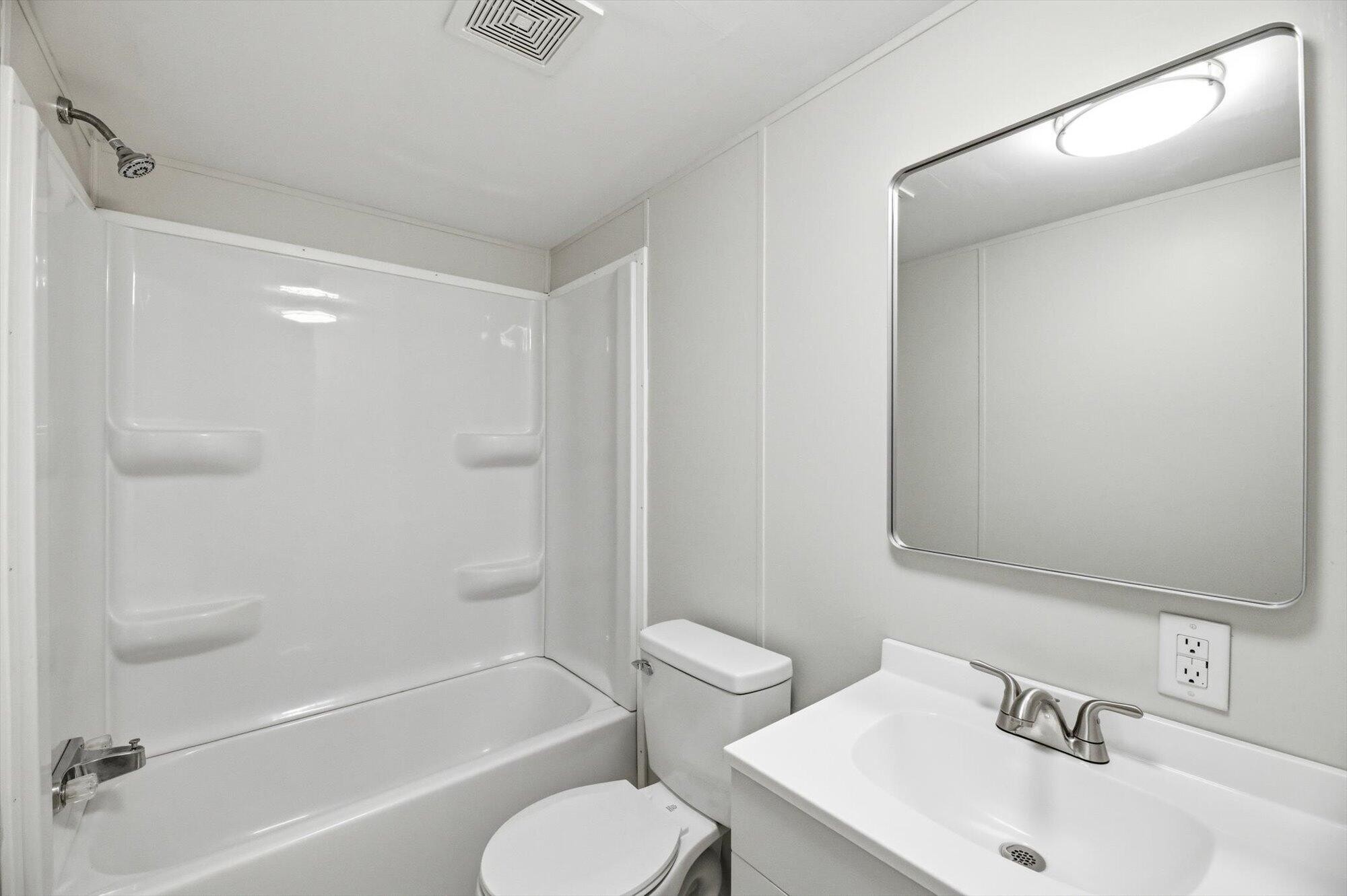 64 County Road 100 Decatur, TN 37322 - Photo 19 of 43 a bathroom with a sink toilet and shower
