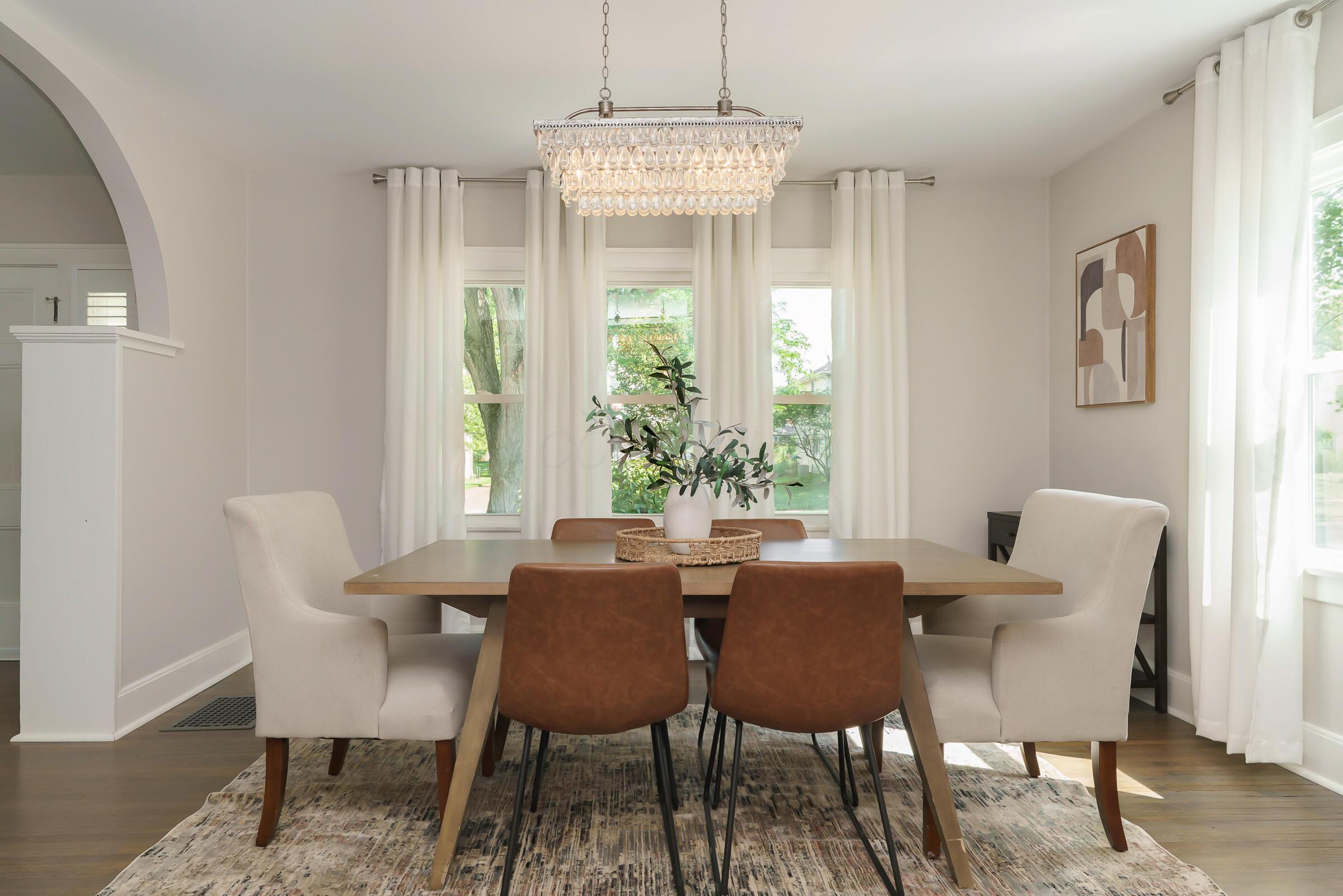 163 Garden Road Columbus, OH 43214 - Photo 13 of 46 A picture perfect dining room is open to the modern kitchen and expansive living room.