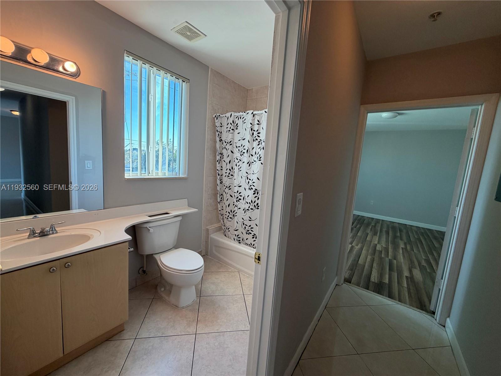 2280 Southwest 32nd Avenue, Unit 216 Miami, FL 33145 - Photo 18 of 34 a bathroom with a sink toilet and window