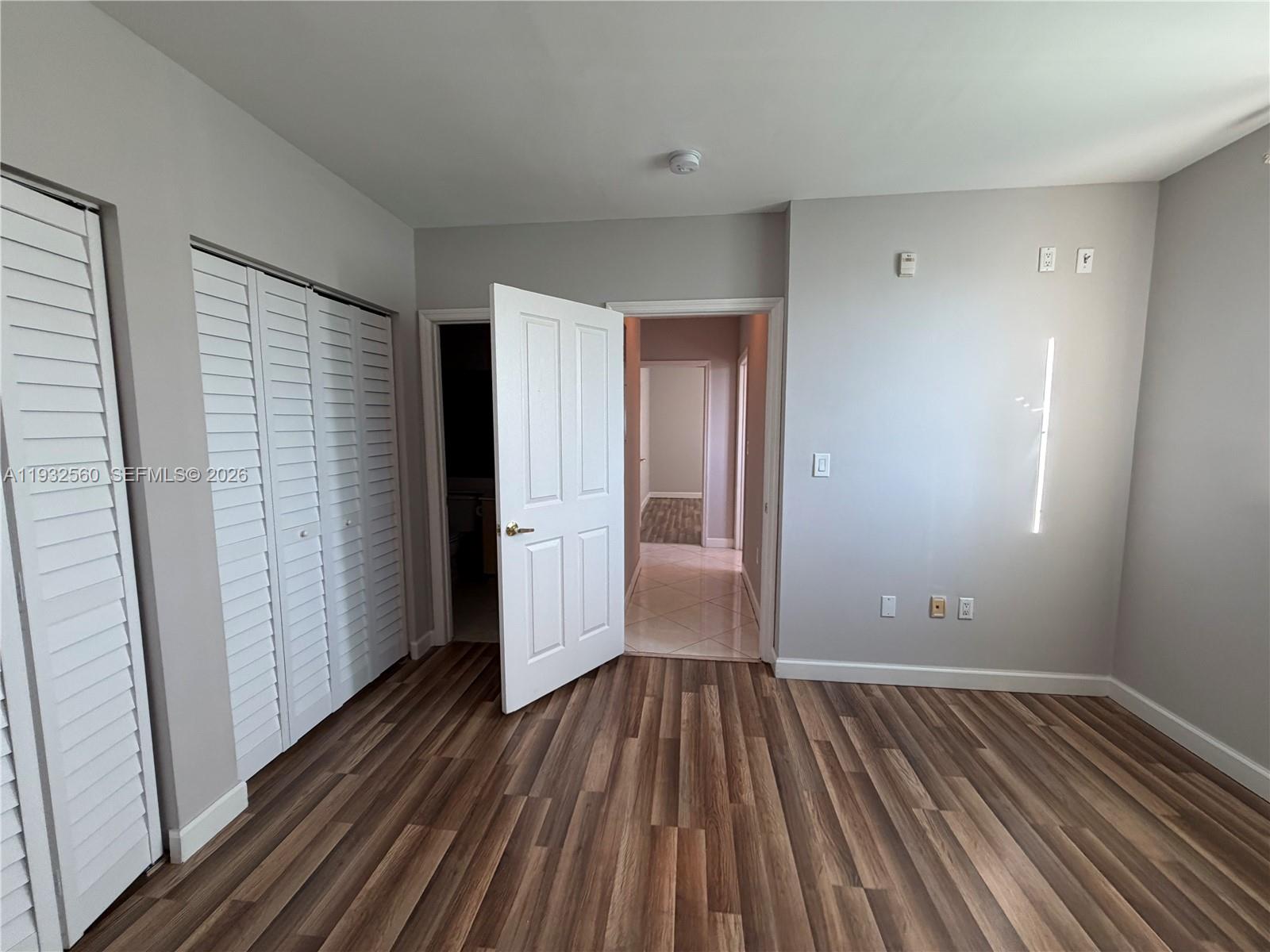 2280 Southwest 32nd Avenue, Unit 216 Miami, FL 33145 - Photo 20 of 34 wooden floor in an empty room