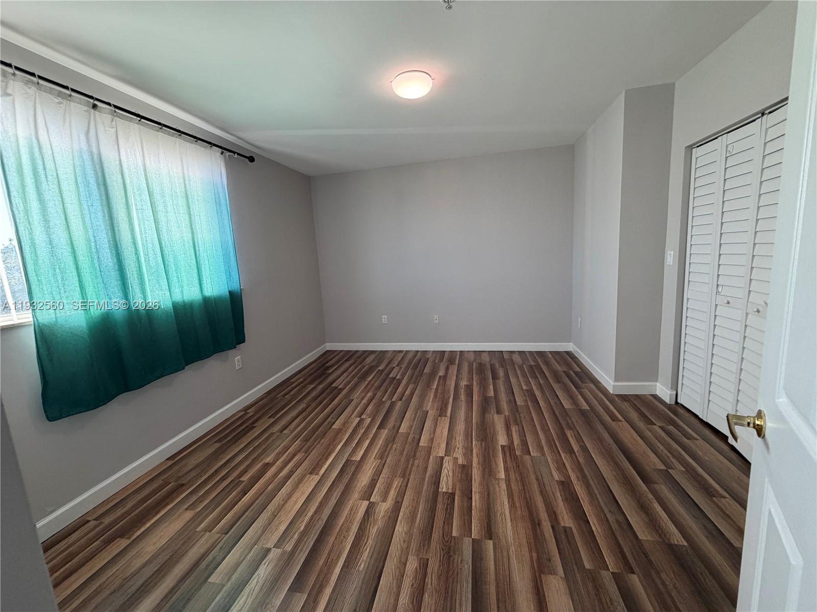 2280 Southwest 32nd Avenue, Unit 216 Miami, FL 33145 - Photo 31 of 34 wooden floor in an empty room