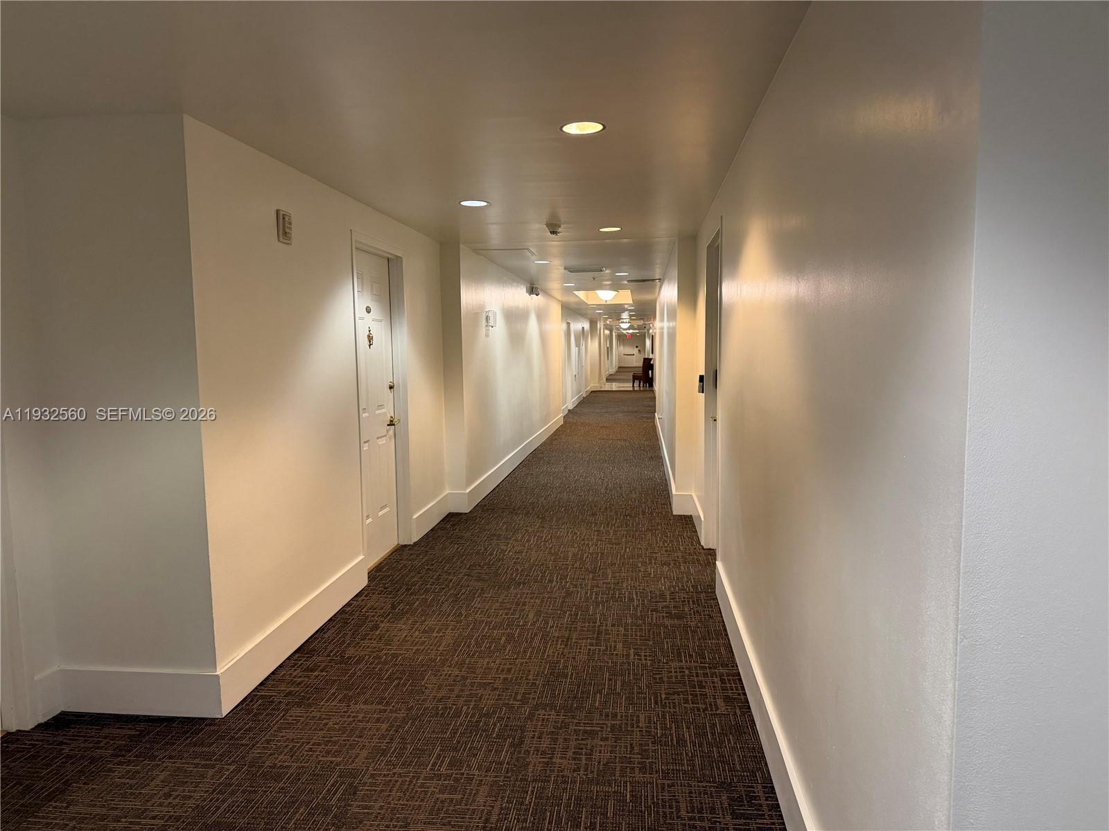 2280 Southwest 32nd Avenue, Unit 216 Miami, FL 33145 - Photo 5 of 34 a view of a hallway with a glass door