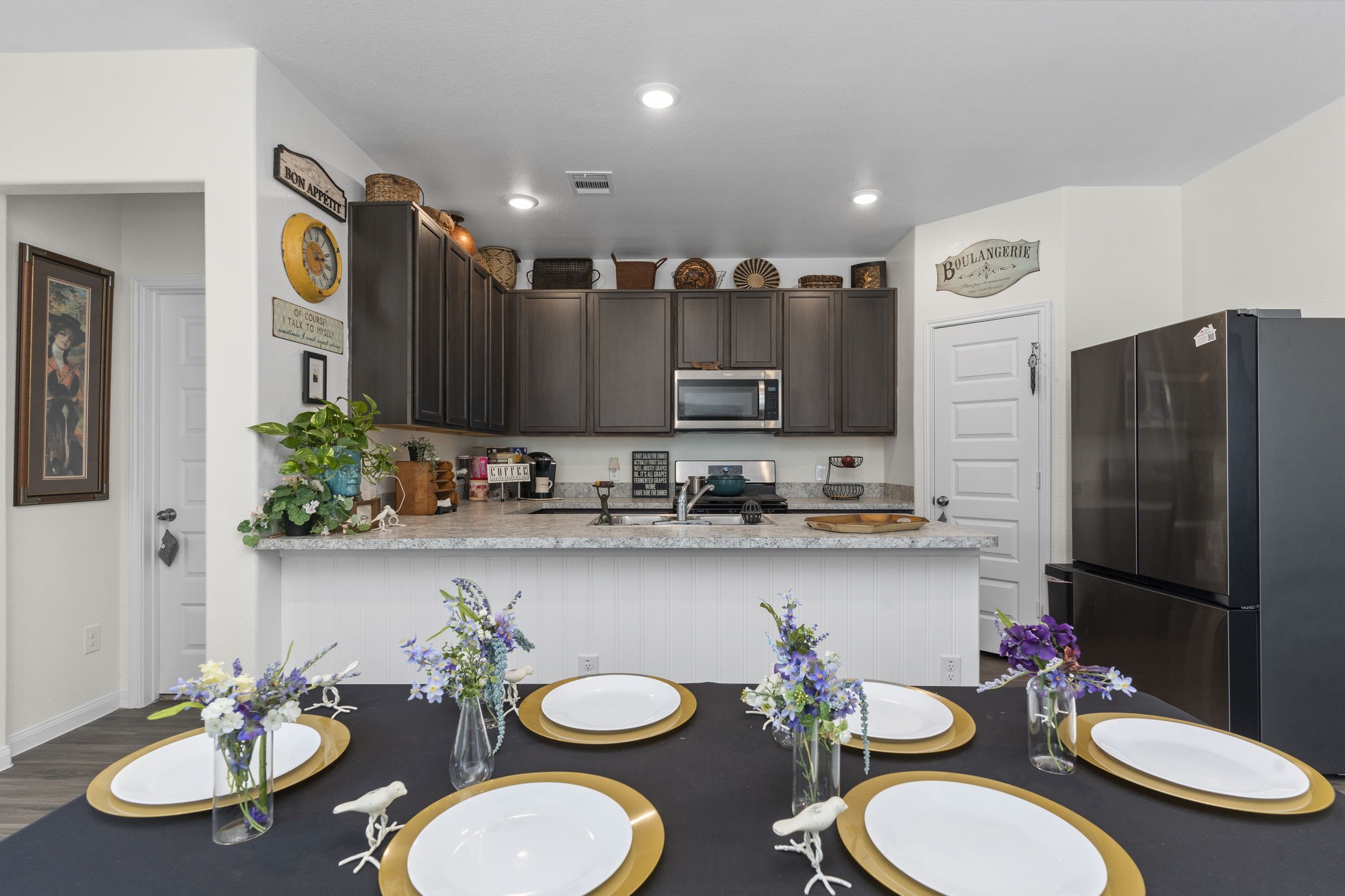 22565 Cormorant Court Splendora, TX 77372 - Photo 19 of 50 a kitchen with a table and chairs in it