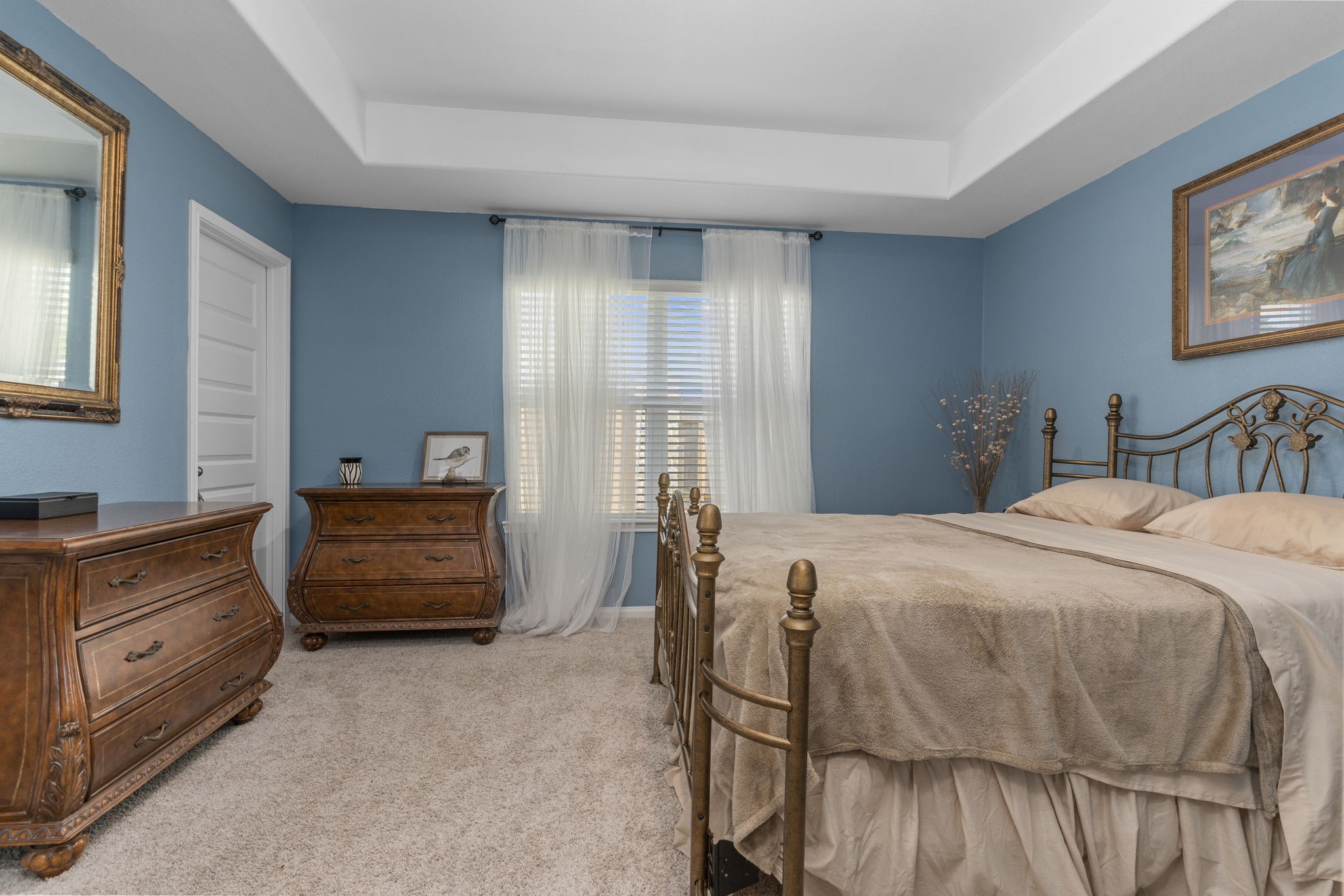 22565 Cormorant Court Splendora, TX 77372 - Photo 25 of 50 a bedroom with a bed and a dresser