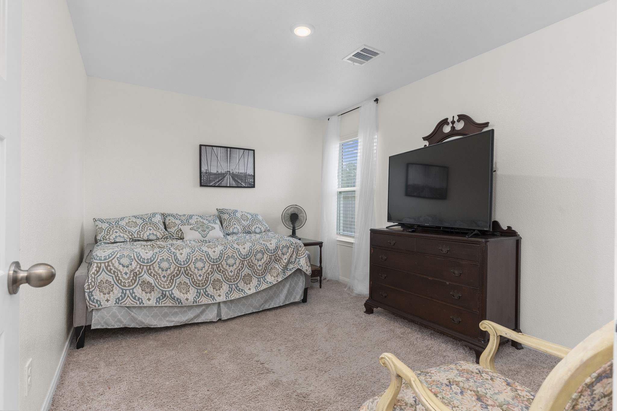22565 Cormorant Court Splendora, TX 77372 - Photo 32 of 50 a living room with furniture and a flat screen tv