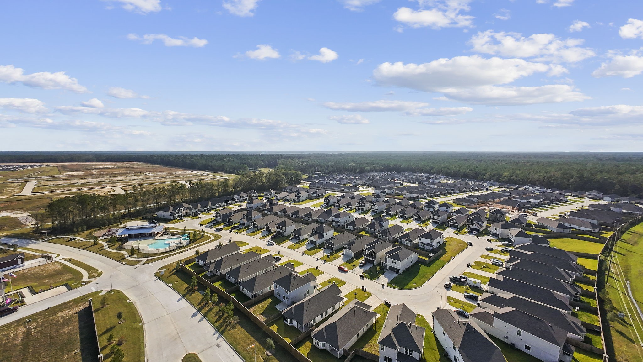 22565 Cormorant Court Splendora, TX 77372 - Photo 42 of 50 an aerial view of residential building and lake