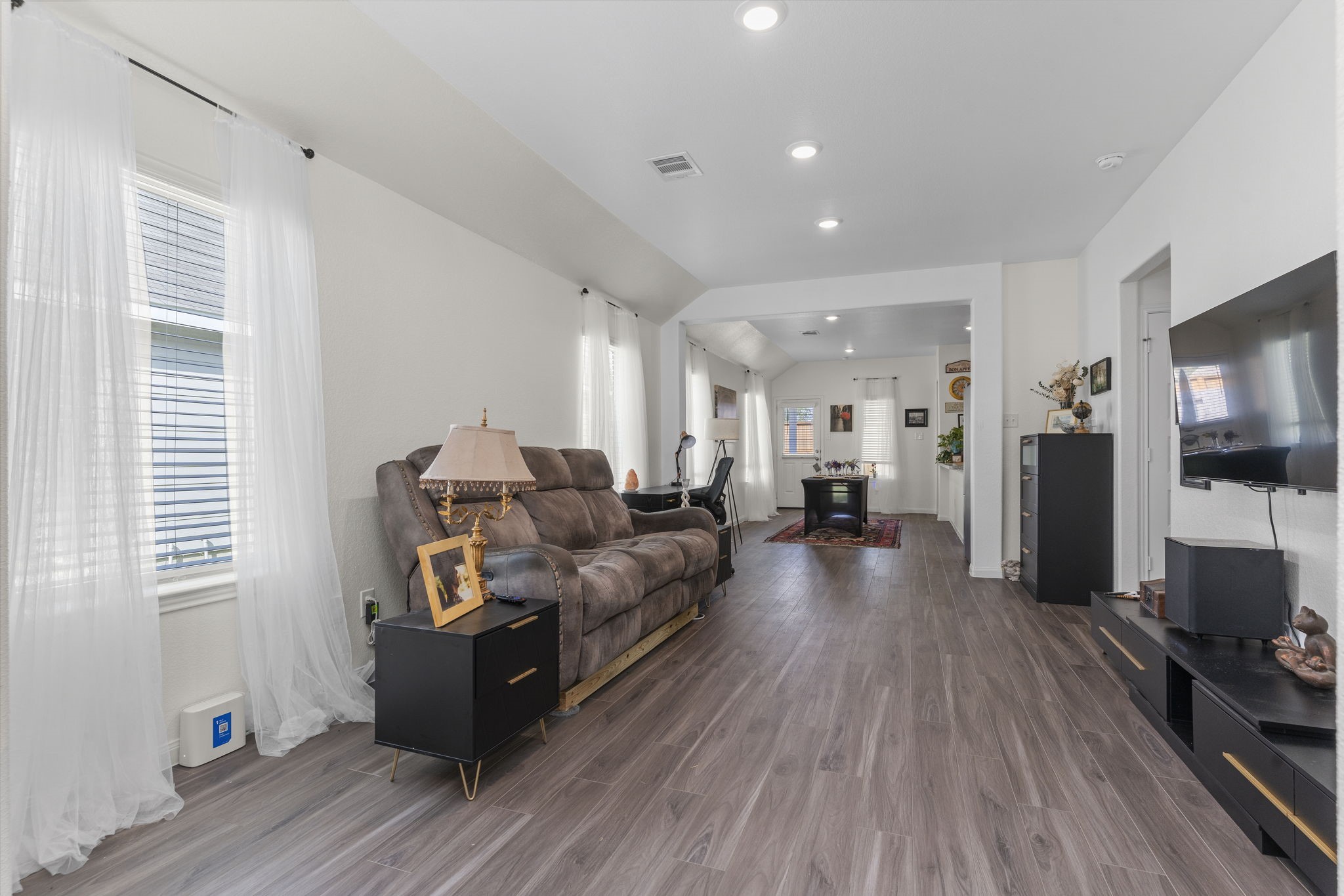 22565 Cormorant Court Splendora, TX 77372 - Photo 8 of 50 a living room with furniture and a flat screen tv