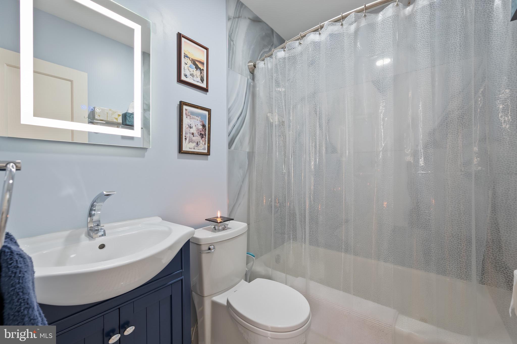 11105 Waycross Way Kensington, MD 20895 - Photo 15 of 35 a bathroom with a sink toilet and shower