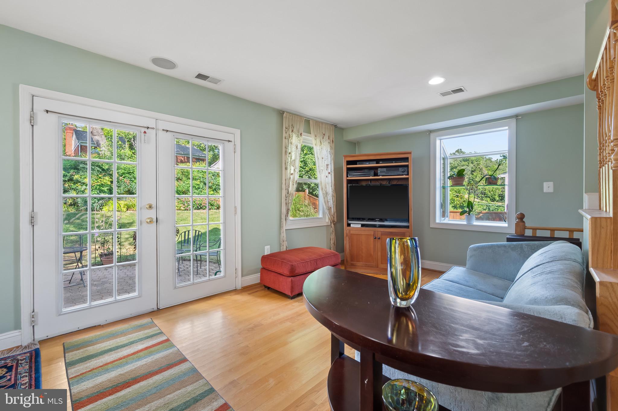 11105 Waycross Way Kensington, MD 20895 - Photo 19 of 35 a living room with furniture and a fireplace