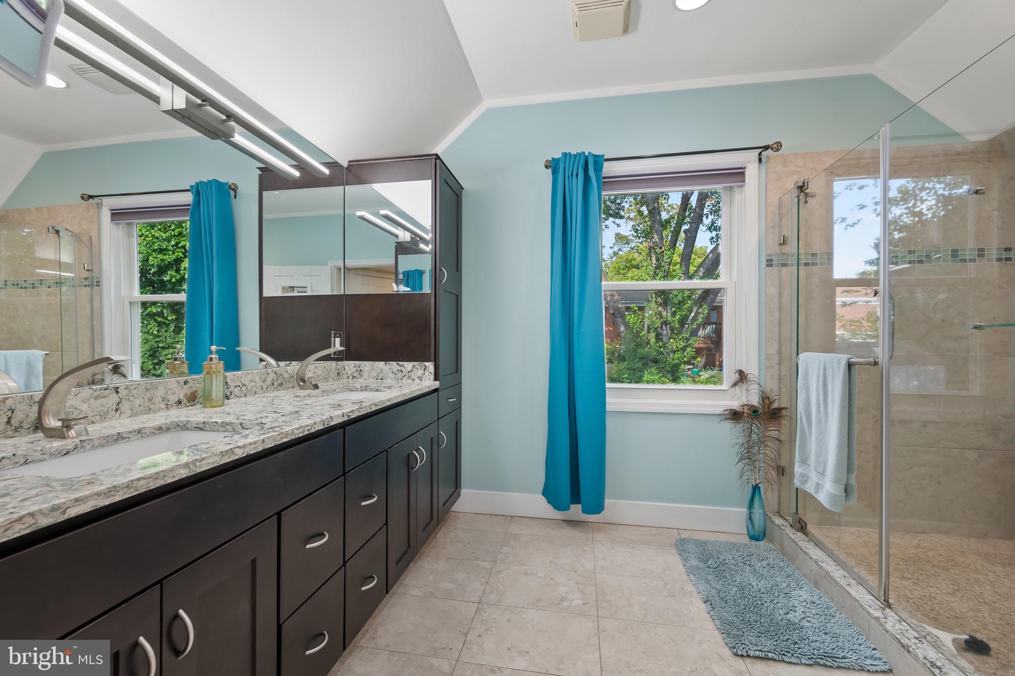 11105 Waycross Way Kensington, MD 20895 - Photo 28 of 35 a bathroom with a granite countertop sink and a mirror