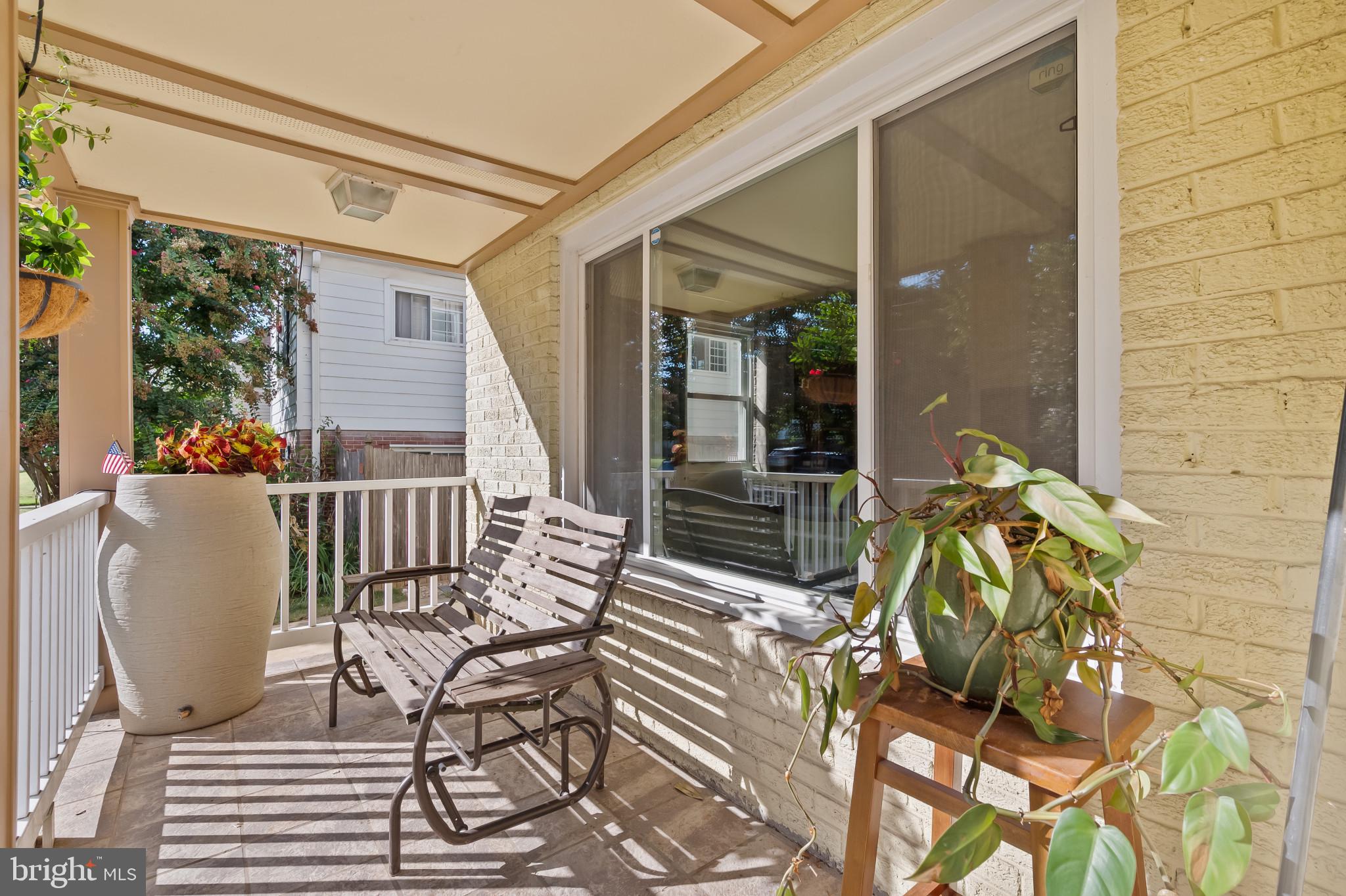 11105 Waycross Way Kensington, MD 20895 - Photo 4 of 35 a balcony view with a couple of chairs and a potted plant