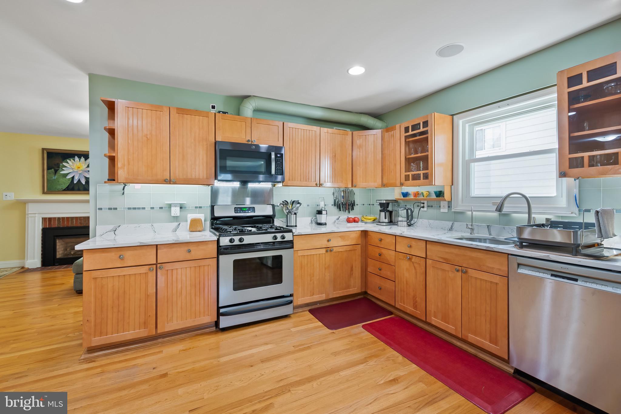 11105 Waycross Way Kensington, MD 20895 - Photo 6 of 35 a kitchen with stainless steel appliances granite countertop a stove a sink dishwasher and a refrigerator