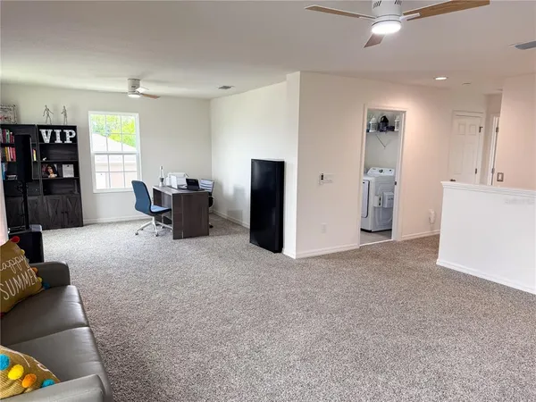a living room with furniture and window