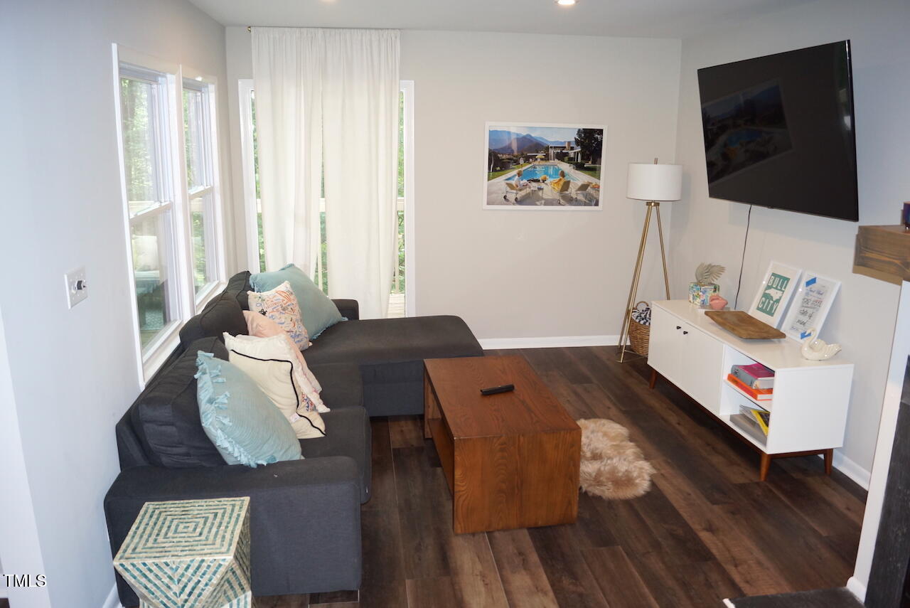 80 Stoneridge Road Durham, NC 27705 - Photo 6 of 27 a living room with furniture and a flat screen tv