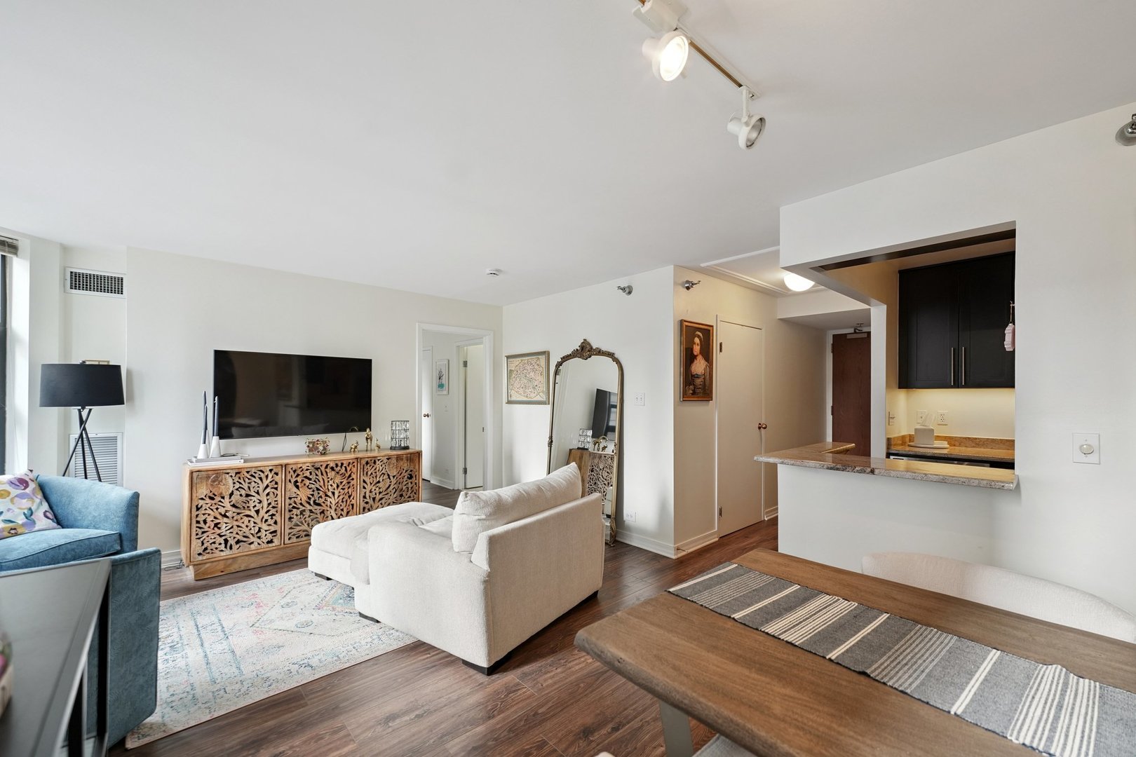 401 East Ontario Street, Unit 2506 Chicago, IL 60611 - Photo 5 of 12 a living room with furniture and a flat screen tv