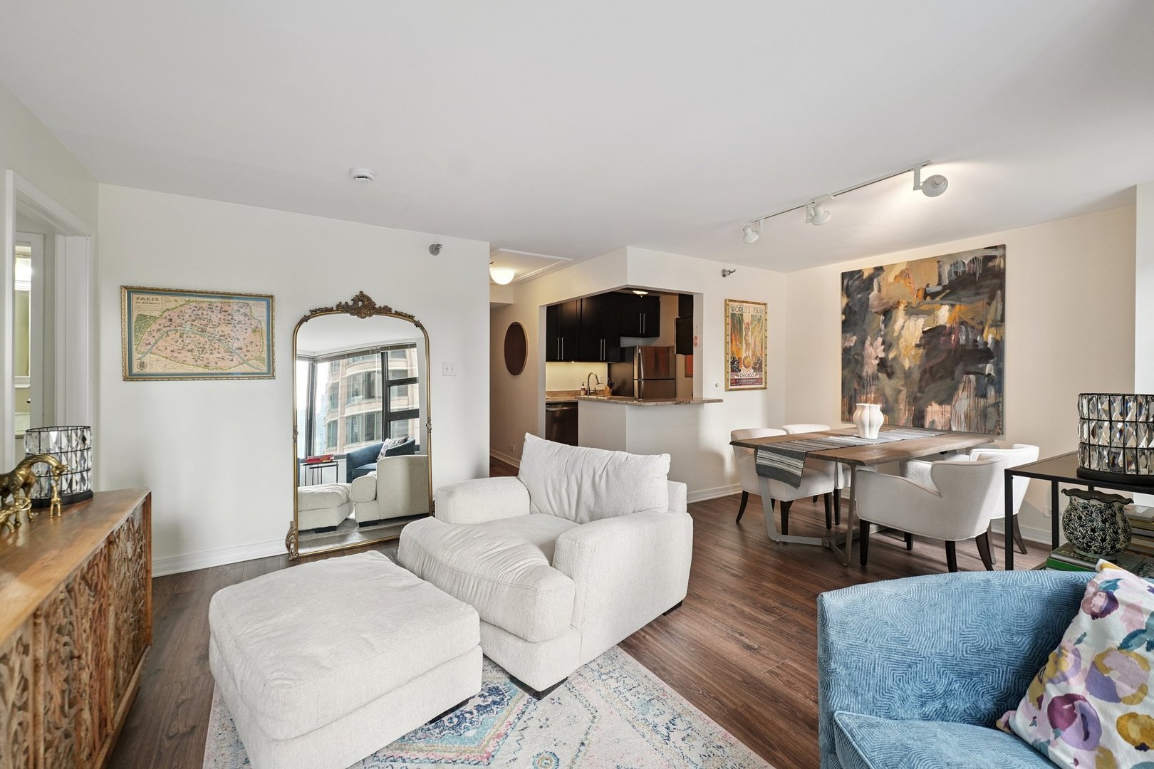 401 East Ontario Street, Unit 2506 Chicago, IL 60611 - Photo 9 of 12 a living room with furniture and a flat screen tv