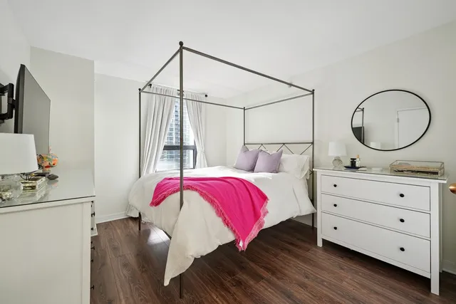 a bedroom with a bed and a closet