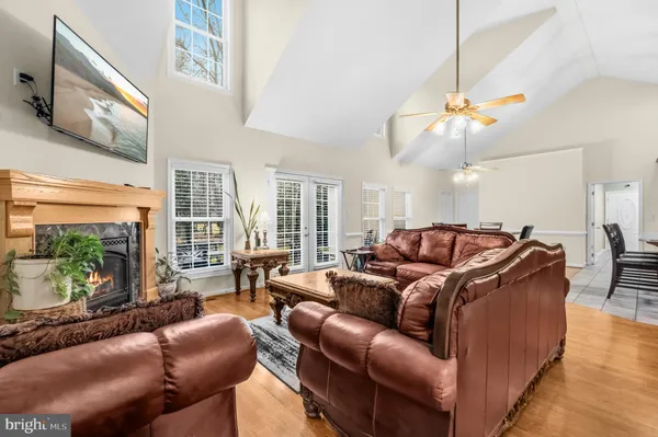 a living room with furniture a rug and a flat screen tv